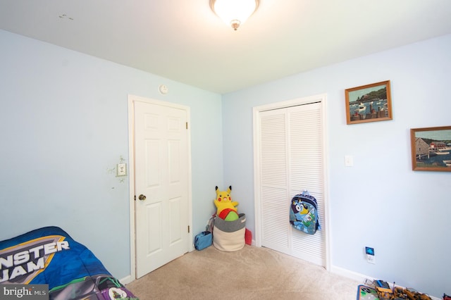 bedroom featuring a closet and carpet