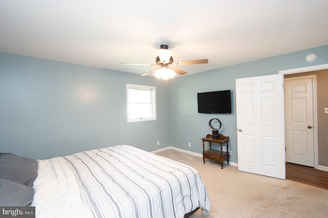 bedroom with light colored carpet and ceiling fan