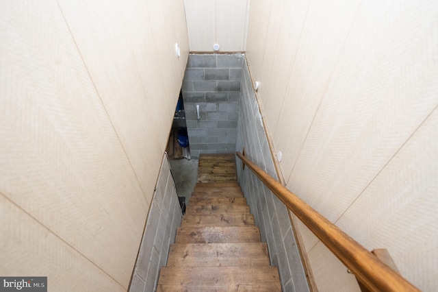 stairs with wood-type flooring