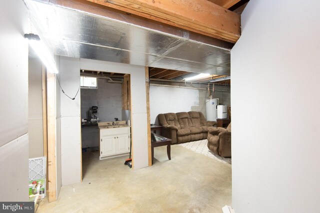 basement with gas water heater and sink