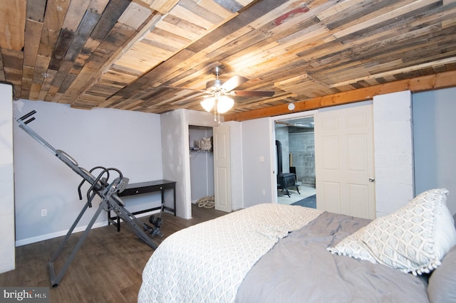 bedroom featuring dark hardwood / wood-style flooring and ceiling fan