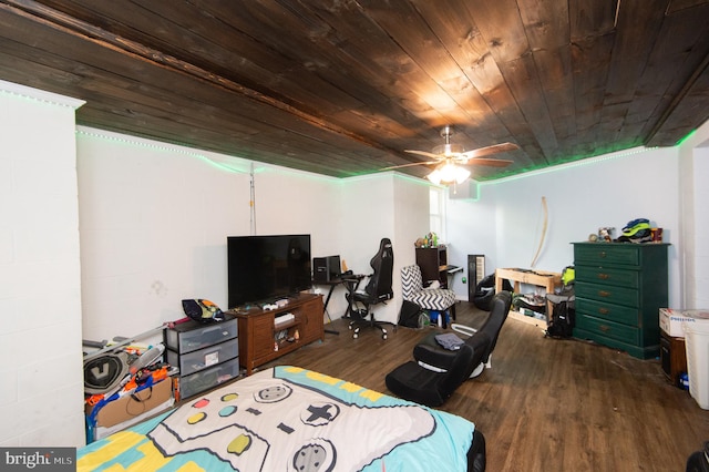 interior space featuring ornamental molding, wood ceiling, ceiling fan, and dark hardwood / wood-style floors