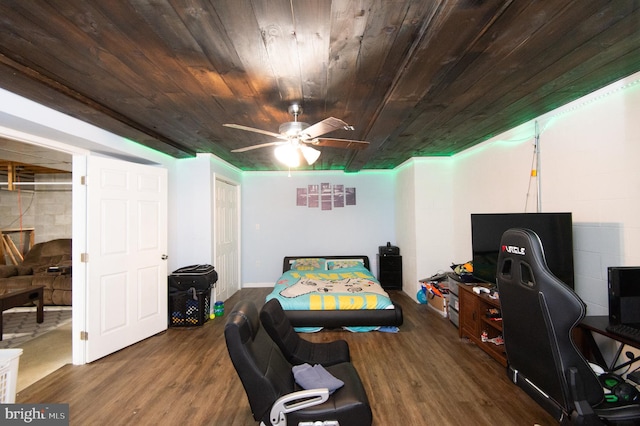 home office with ceiling fan, wood ceiling, and dark hardwood / wood-style flooring