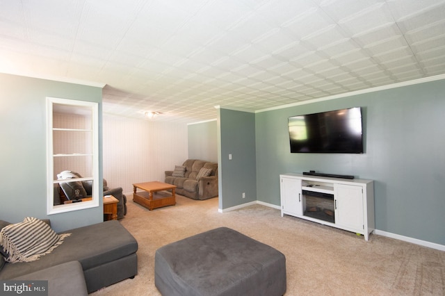 living room featuring ornamental molding and light carpet