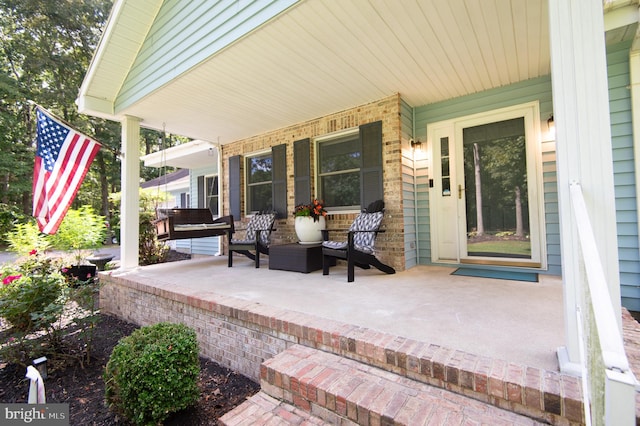 view of patio featuring a porch