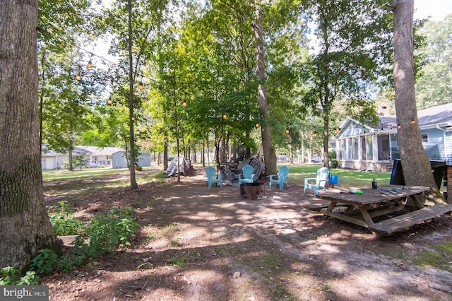 view of yard featuring a sunroom