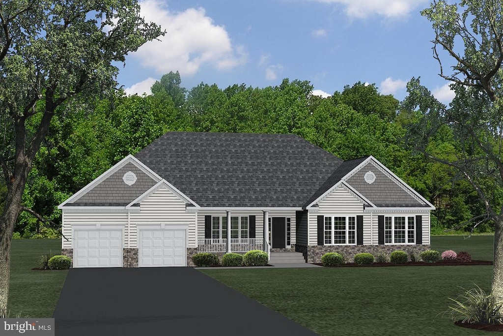 view of front of property with a garage, covered porch, and a front yard