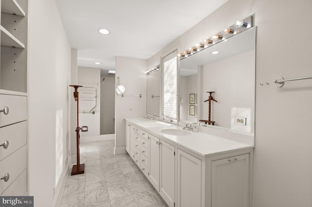 bathroom with a shower and vanity