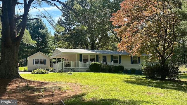 single story home with a front yard and a porch