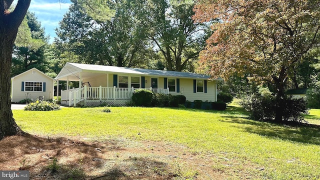 single story home with a front yard and a porch