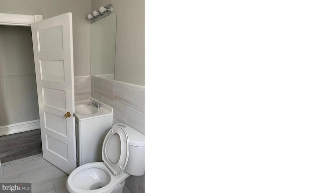 bathroom featuring vanity, toilet, and tile patterned flooring