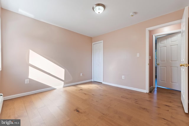 unfurnished bedroom featuring wood-type flooring