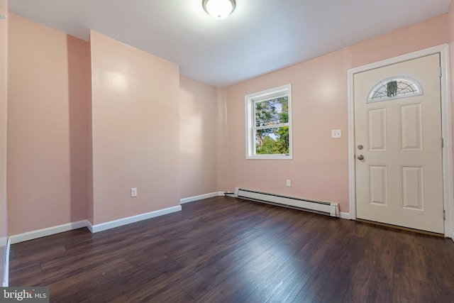 entrance foyer featuring a baseboard heating unit and dark hardwood / wood-style flooring