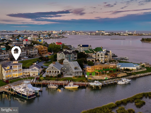 aerial view at dusk with a water view