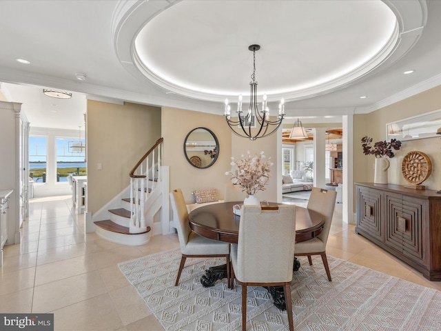 9601 Ocean Vw, Ocean City, MD 21842 - dining space featuring a raised ceiling, stairway, light tile patterned floors, and a chandelier