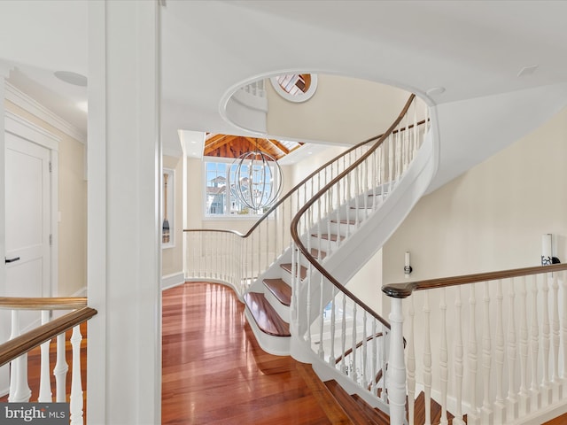 9601 Ocean Vw, Ocean City, MD 21842 - staircase featuring an inviting chandelier and wood finished floors