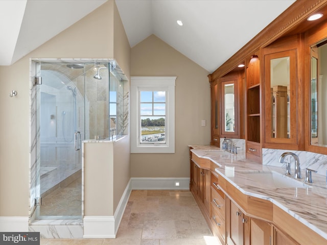 9601 Ocean Vw, Ocean City, MD 21842 - bathroom with lofted ceiling, a stall shower, a sink, double vanity, and baseboards