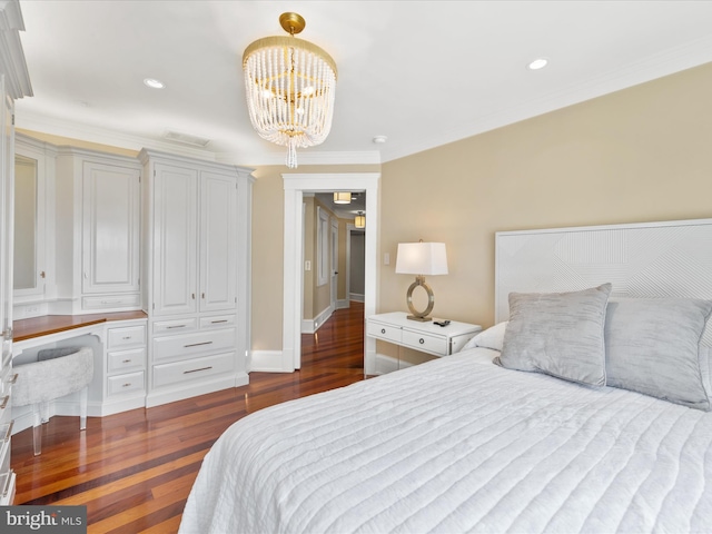 bedroom featuring crown molding, dark hardwood / wood-style floors, and an inviting chandelier