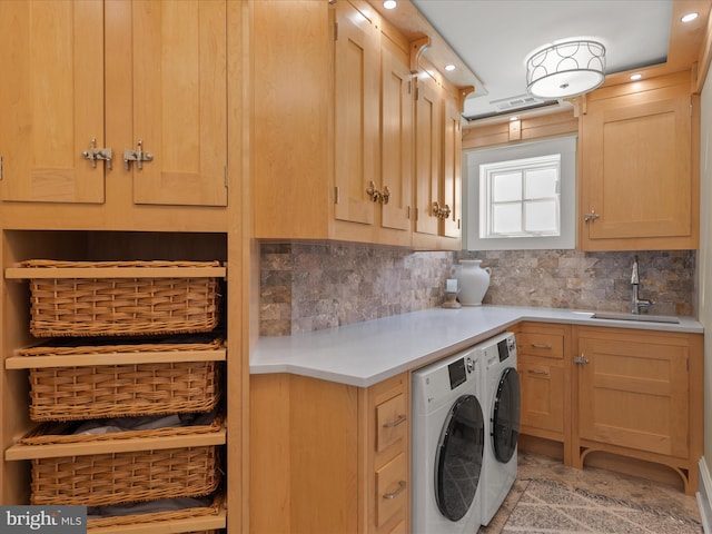 9601 Ocean Vw, Ocean City, MD 21842 - washroom featuring a sink, cabinet space, and separate washer and dryer