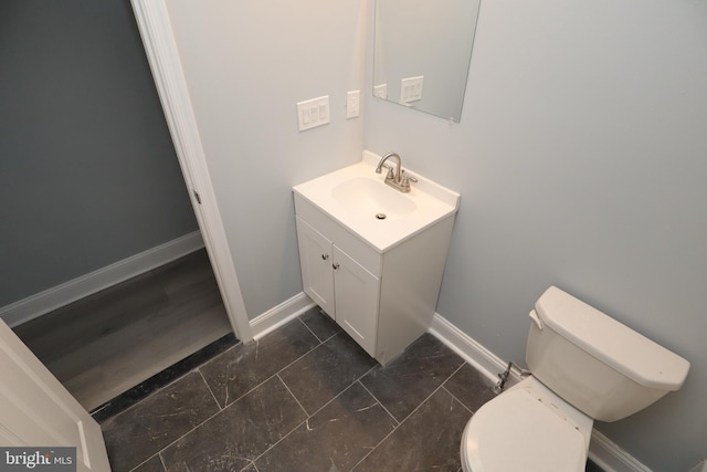 bathroom with toilet and vanity