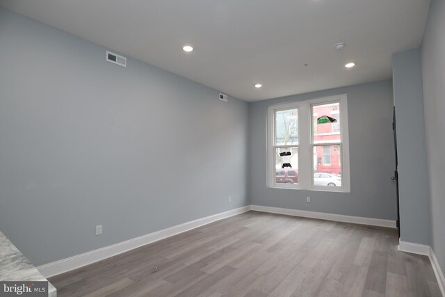 empty room with light hardwood / wood-style floors