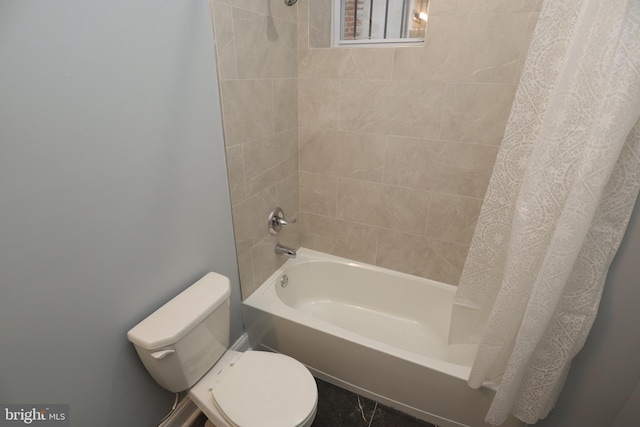 bathroom with toilet and shower / tub combo with curtain