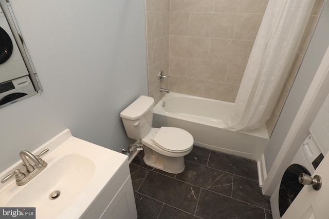 full bathroom featuring vanity, toilet, shower / tub combo, and stacked washer and dryer