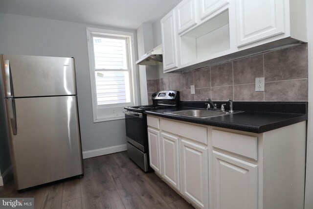 kitchen with white cabinets, dark hardwood / wood-style flooring, stainless steel appliances, and sink