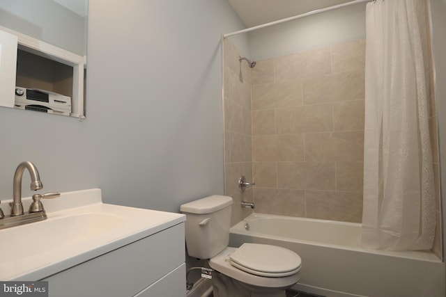 full bathroom featuring vanity, toilet, and shower / bathtub combination with curtain