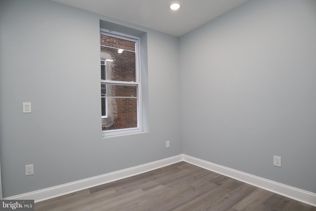 empty room with hardwood / wood-style floors