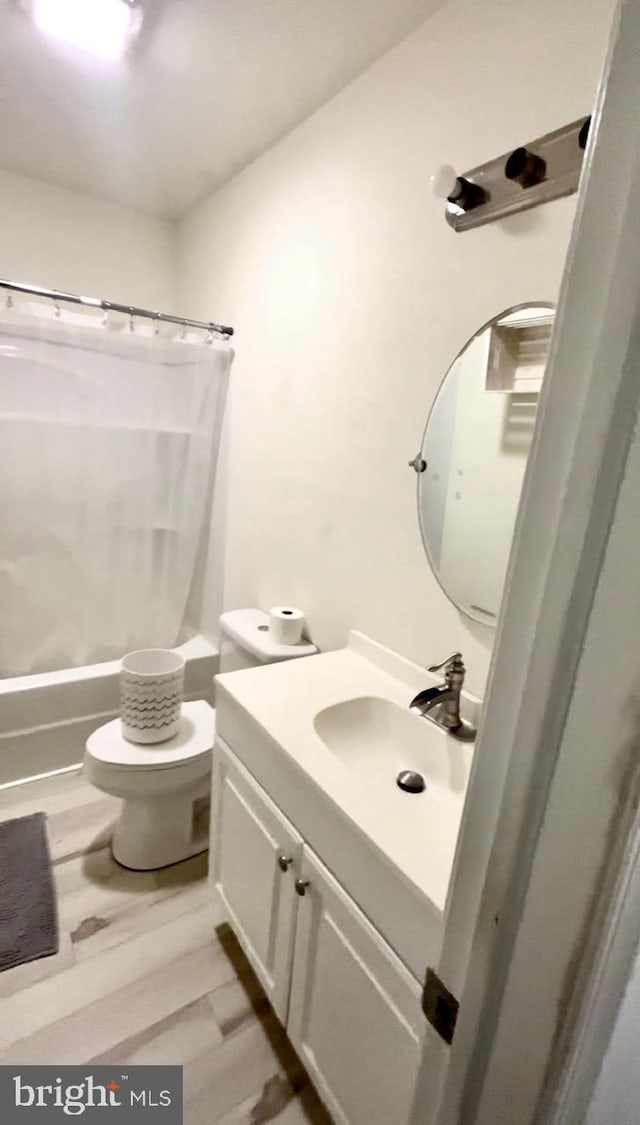 5601 Briarwood Dr, Millville, NJ 08332 - bathroom with toilet, vanity, shower / bath combination with curtain, and wood finished floors