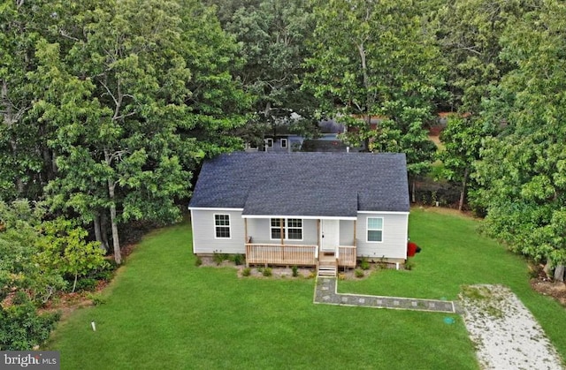 view of front of home with a front lawn and a wooden deck