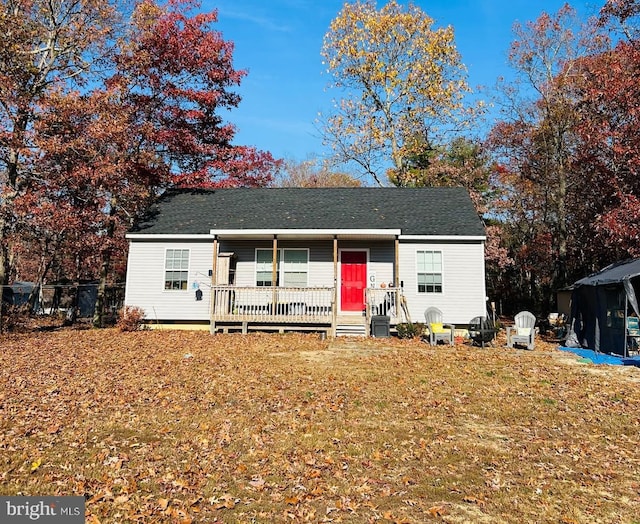 5601 Briarwood Dr, Millville, NJ 08332 - view of front of property featuring covered porch, a front yard, a shingled roof, and crawl space