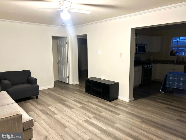 5601 Briarwood Dr, Millville, NJ 08332 - living area with crown molding, wood finished floors, ceiling fan, and baseboards