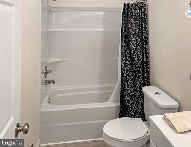 bathroom featuring wood-type flooring, toilet, and shower / tub combo with curtain