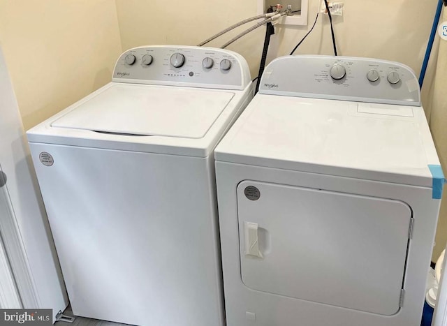 washroom with separate washer and dryer