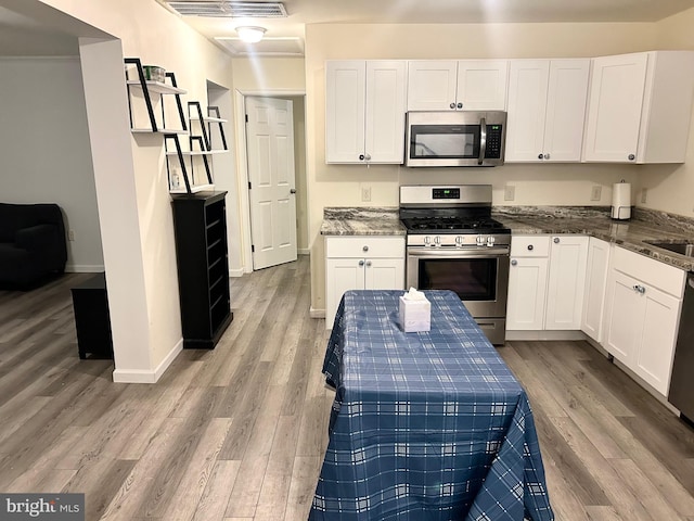 5601 Briarwood Dr, Millville, NJ 08332 - kitchen featuring stainless steel appliances, light wood-style floors, and white cabinets