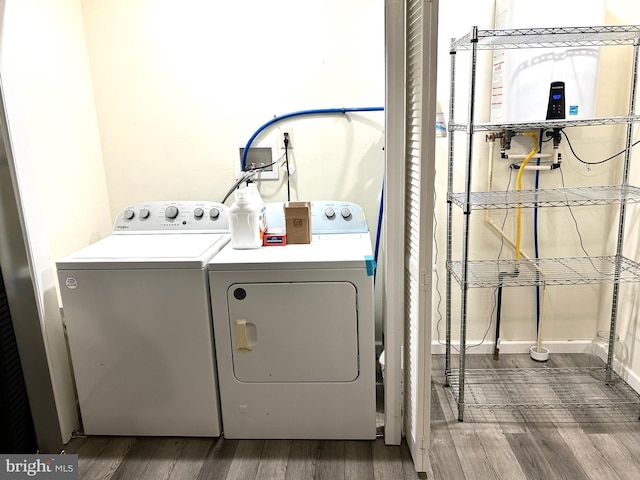 5601 Briarwood Dr, Millville, NJ 08332 - laundry room featuring washing machine and dryer and dark wood-style flooring