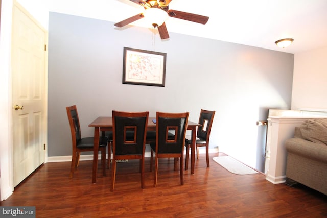 dining room featuring ceiling fan and dark hardwood / wood-style floors