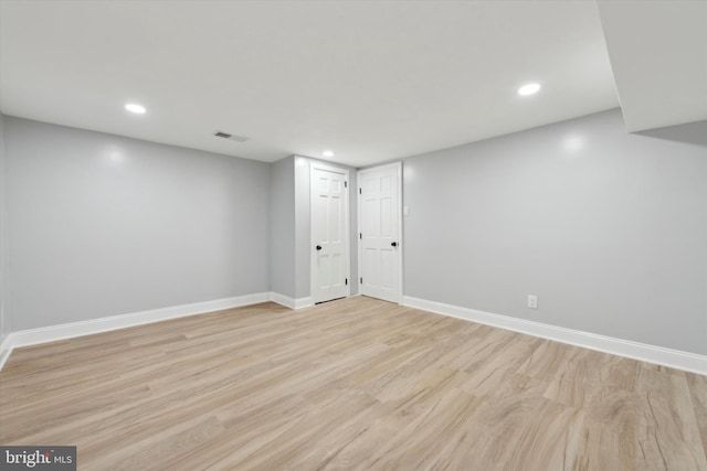 basement featuring light hardwood / wood-style floors