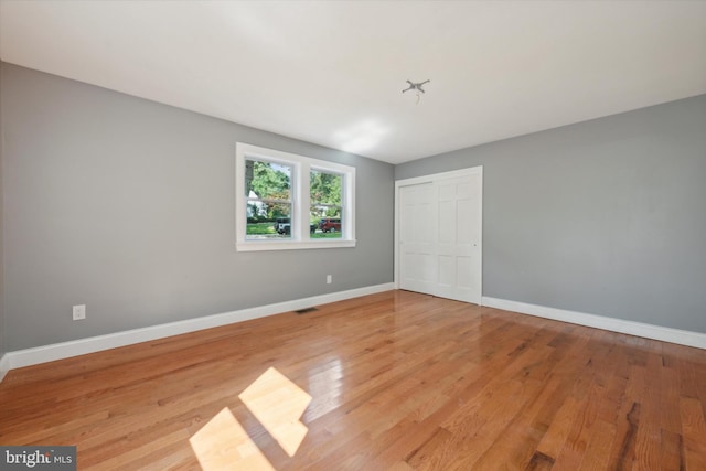 spare room featuring light hardwood / wood-style flooring