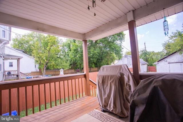 wooden terrace featuring grilling area