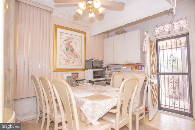 dining room featuring a textured ceiling and ceiling fan