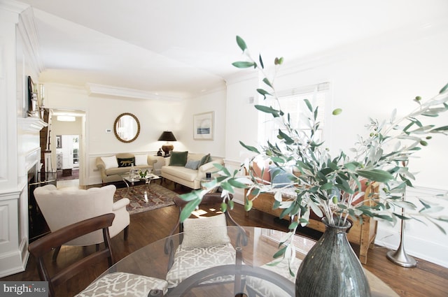 dining room featuring crown molding and dark hardwood / wood-style flooring