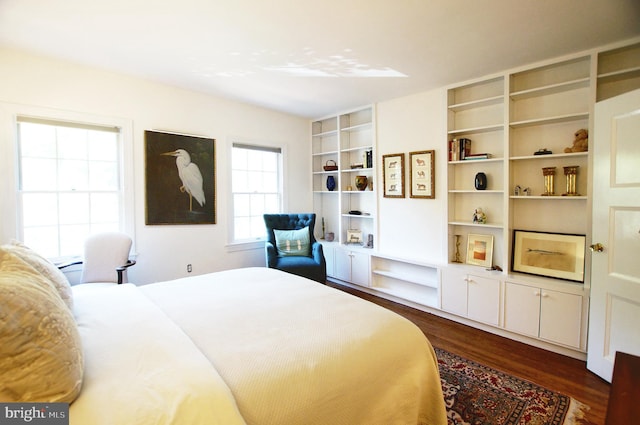 bedroom featuring dark hardwood / wood-style flooring