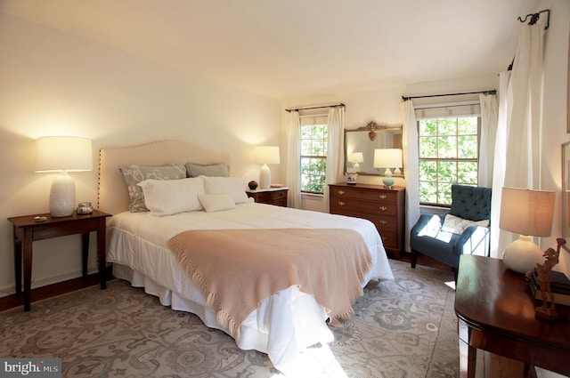 bedroom featuring multiple windows