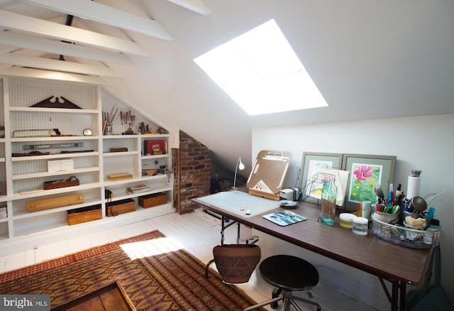 office featuring lofted ceiling with skylight