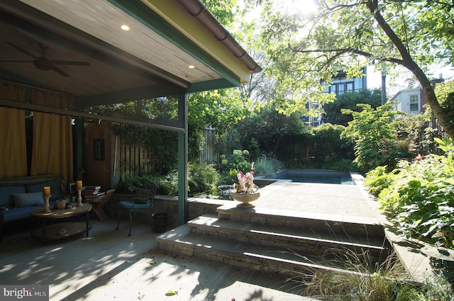 wooden deck featuring ceiling fan and a patio area