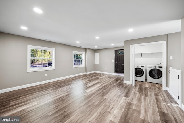 interior space with recessed lighting, wood finished floors, laundry area, and washer and clothes dryer