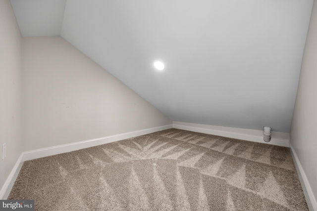 additional living space featuring recessed lighting, baseboards, carpet floors, and vaulted ceiling